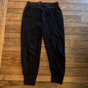 Black Vuori joggers, excellent condition. Side small, polyester material